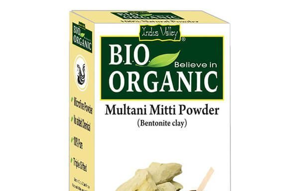 5 Benefits of Multani Mitti for Skin and Hair Clay powder face mask ingredients arranged in a bowl