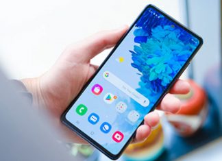 HOW TO USE THE GALAXY PHONE FOR BEGINNERS Person setting up an Android smartphone in both hands
