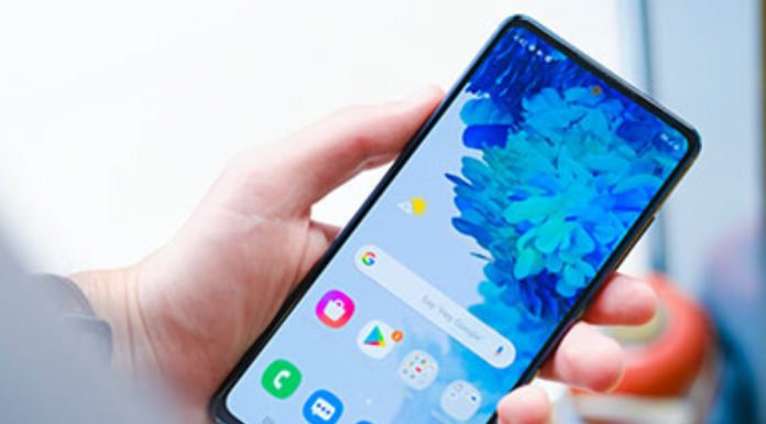 HOW TO USE THE GALAXY PHONE FOR BEGINNERS Person setting up an Android smartphone in both hands