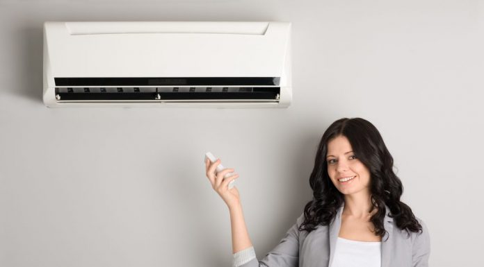 How to day air conditioner repair in Toronto Technician servicing an outdoor air conditioning unit